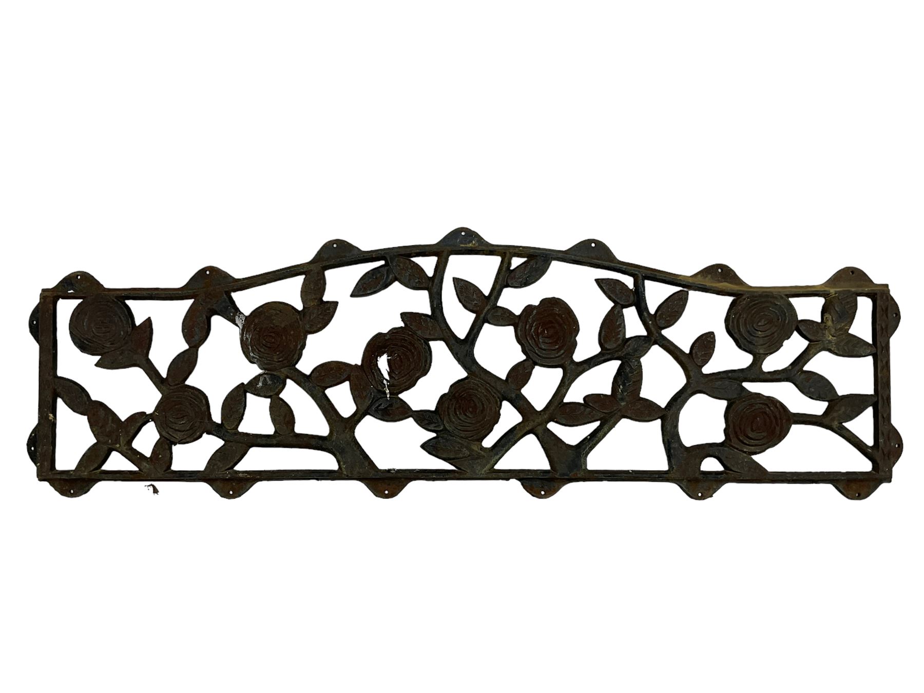 Pair cast iron garden bench ends decorated with scrolling design (H83cm), another pair of cast iron bench ends (H78cm), and a cast iron bench back decorated with foliage branches and roses (W110cm x H30cm)