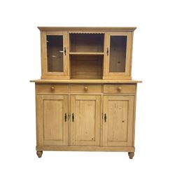 Early 20th century French pine side cabinet or dresser, fitted with two glazed cupboards flanking central shelf, over three drawers and three cupboards