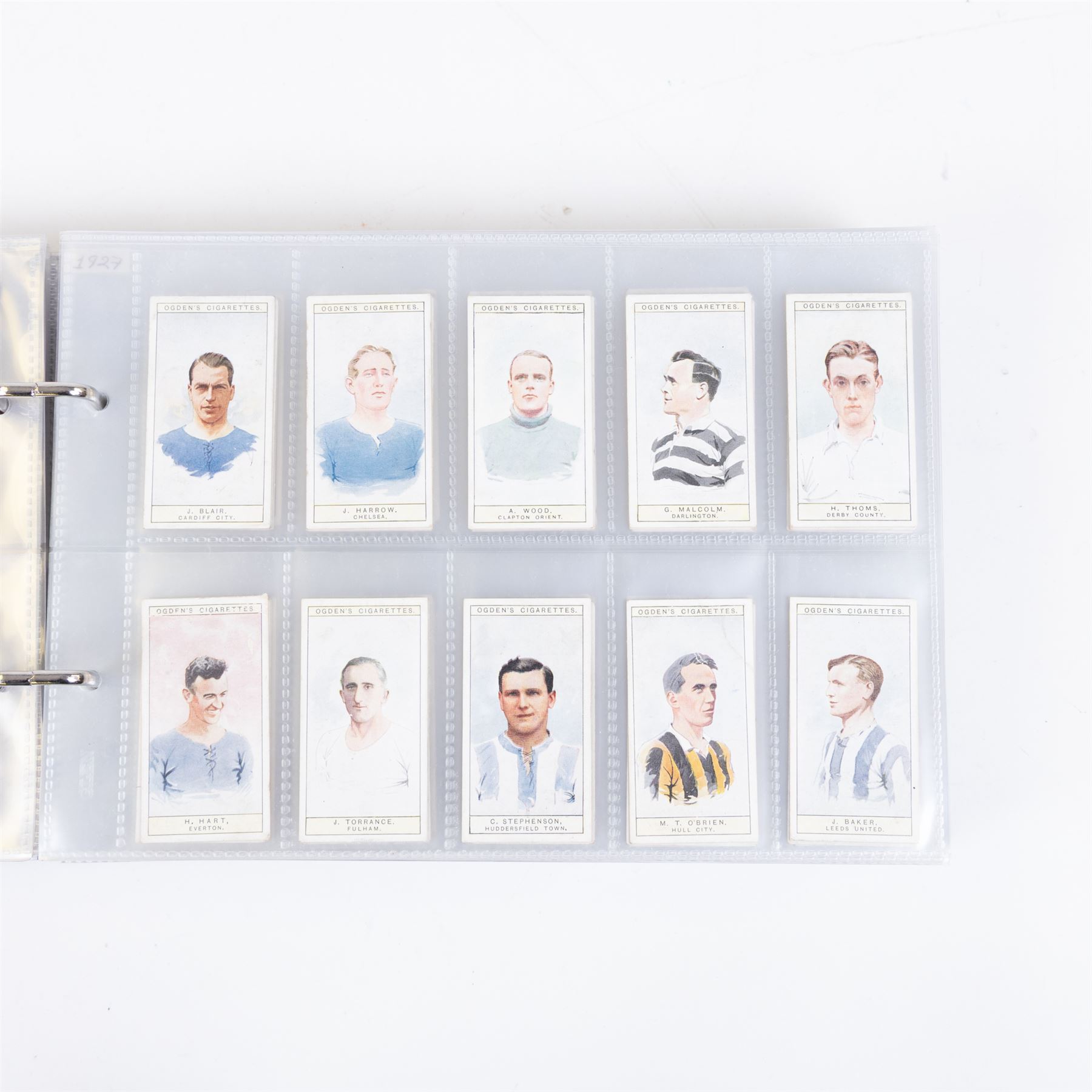 Collection of Edwardian and later Football related trading and cigarette cards, including forty-nine of fifty 1906 Ogden's Football Club Colours, 1922 PALS Footall series, ninety of one hundred 1925 Gallaher Famous Footballers, complete set of forty-four 1926 Ogden's Captains of Association Football Clubs and Colours, complete set of fifty 1927 Players Football Caricatures by MAC,  complete set of fifty 1927 Players Football Caricatures by RIP,  complete set of fifty 1930 Players Association Cup Winners, complete set of 50 1933 Ogdens AFC Nicknames etc, housed in brown cigarette card album
