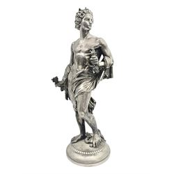 20th century silver plated figure, modelled as a classical male figure, possibly Prometheus, holding flames, one foot resting atop a small dragon, upon a circular spreading base, overall H37.5cm