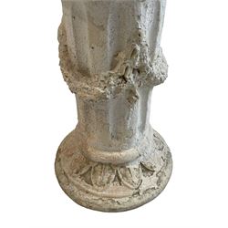 Pair of cast stone classical design pedestals, circular top over fluted body decorated with bellflower festoons, circular base moulded with leaf decoration 