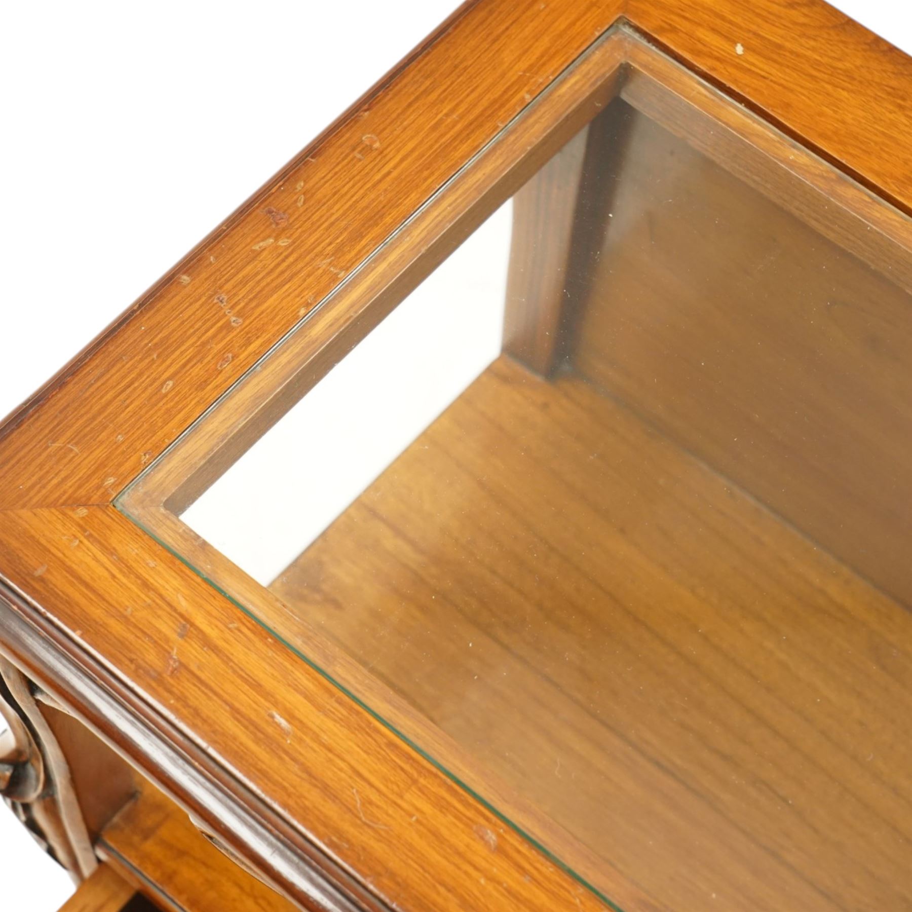 And So To Bed - pair of cherry wood and cane 'Libertine' bedside tables, glass top above a shaped and carved apron, with open recess above two drawers with brass handle, flanked by caned sides, raised on short cabriole supports 