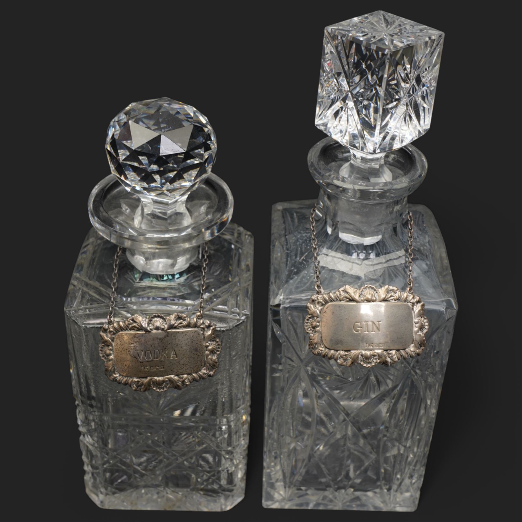 Six crystal decanters, four with silver labels and one with silver plated mount, and one etched glass dinner bell, tallest H30cm 