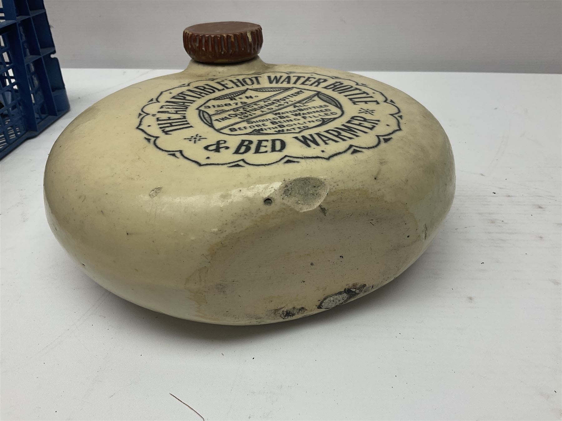 The Adaptable Hot Water Bottle & Bed Warmer made at Old Fulham Pottery, together with six vintage woodworking planes