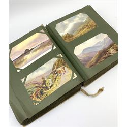 An Edwardian album containing approximately four hundred Edwardian and later postcards, to include real photographic and printed British and foreign topographical, shipping including Lusitania, Native American Indians, etc.