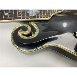 Eastern F-hole eight-string mandolin with black finish and mother-of-pearl inlay of a man riding a winged horse/unicorn amongst clouds and stars with playing card suits to the fingerboard L71cm