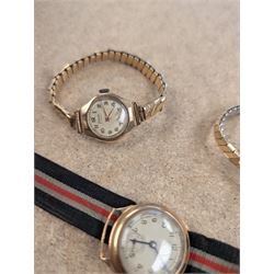 Two ladies 9ct gold cased manual wind wrist watches, both on expanding base metal straps, together with a gentlemans 9ct gold cased wristwatch on canvas strap