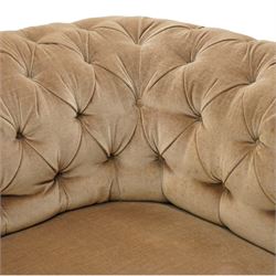 Victorian mahogany framed two seater Chesterfield settee, traditional shape with rolled back and arms over sprung seat, upholstered in buttoned-back neutral fabric, raised on turned front supports with ceramic castors