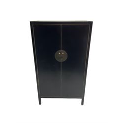Chinese design black lacquered wardrobe, two cupboard doors enclosing hanging rail and two drawers