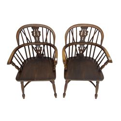 Pair late 20th century oak Windsor elbow chairs, double hoop and stick back with pierced and fretwork work splat, dished seat on turned supports joined by crinoline stretcher