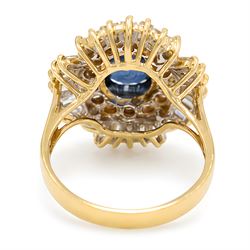 18ct gold sapphire and diamond cluster ring, single oval cut sapphire of approx 2.05 carat, surrounded by two rows of round brilliant cut and baguette cut diamonds, Sheffield import mark 1994, total round cut diamond weight approx 0.55 carat