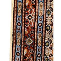 Large Persian Herati ivory ground 18' runner, seven floral medallions and a field decorated with repeating Herati motifs, three-band border decorated with geometric and flower head motifs
