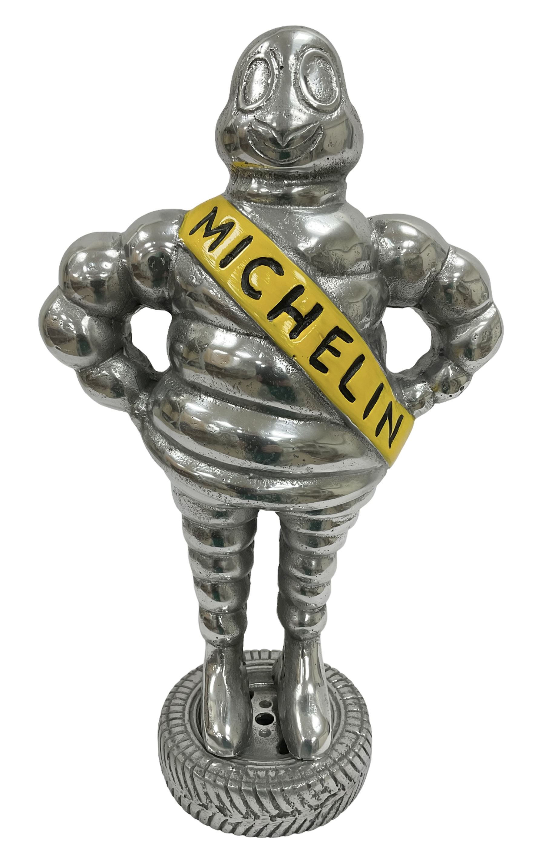 Polished aluminium Michelin man style figure, H38cm.