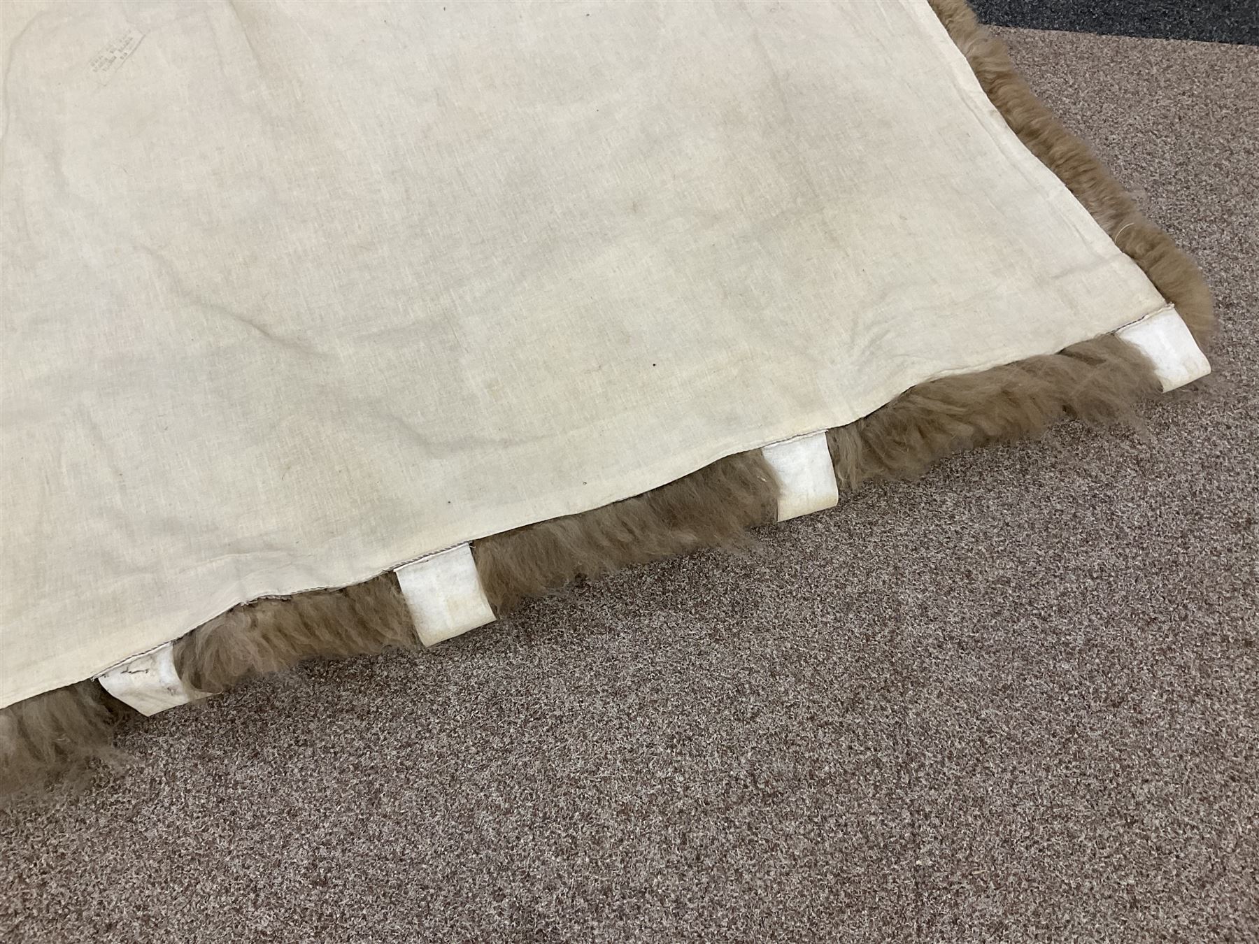 Alpaca rug/wall hanging depicting a gorilla on a cream background 