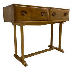 Ercol - circa. 1960s elm and beech side or console table, fitted with two drawers, pillar supports on sledge feet joined by stretcher 