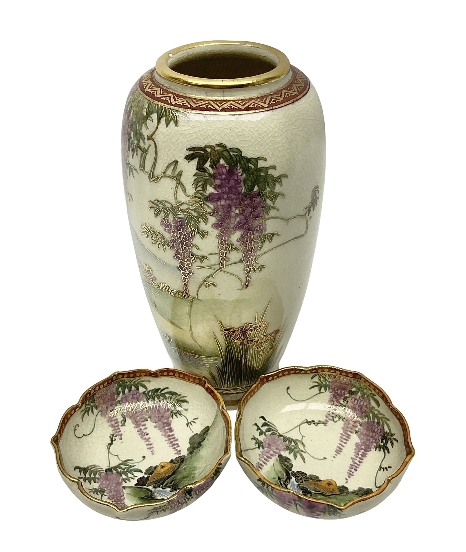 Japanese Satsuma Meiji period vase painted with a mountainous river landscape scene with wisteria and irises; together with a pair of similarly painted small dishes, signature beneath, vase H15cm