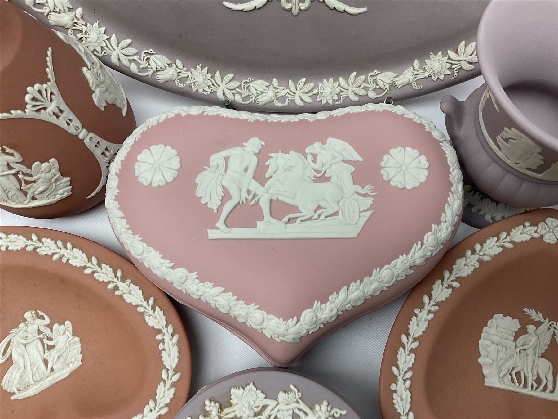 Collection of Wedgwood Jasperware, in orange, lilac and pink colourways, including oval tray, small jug, trinket boxes, trinket dishes, etc , all with impressed mark beneath