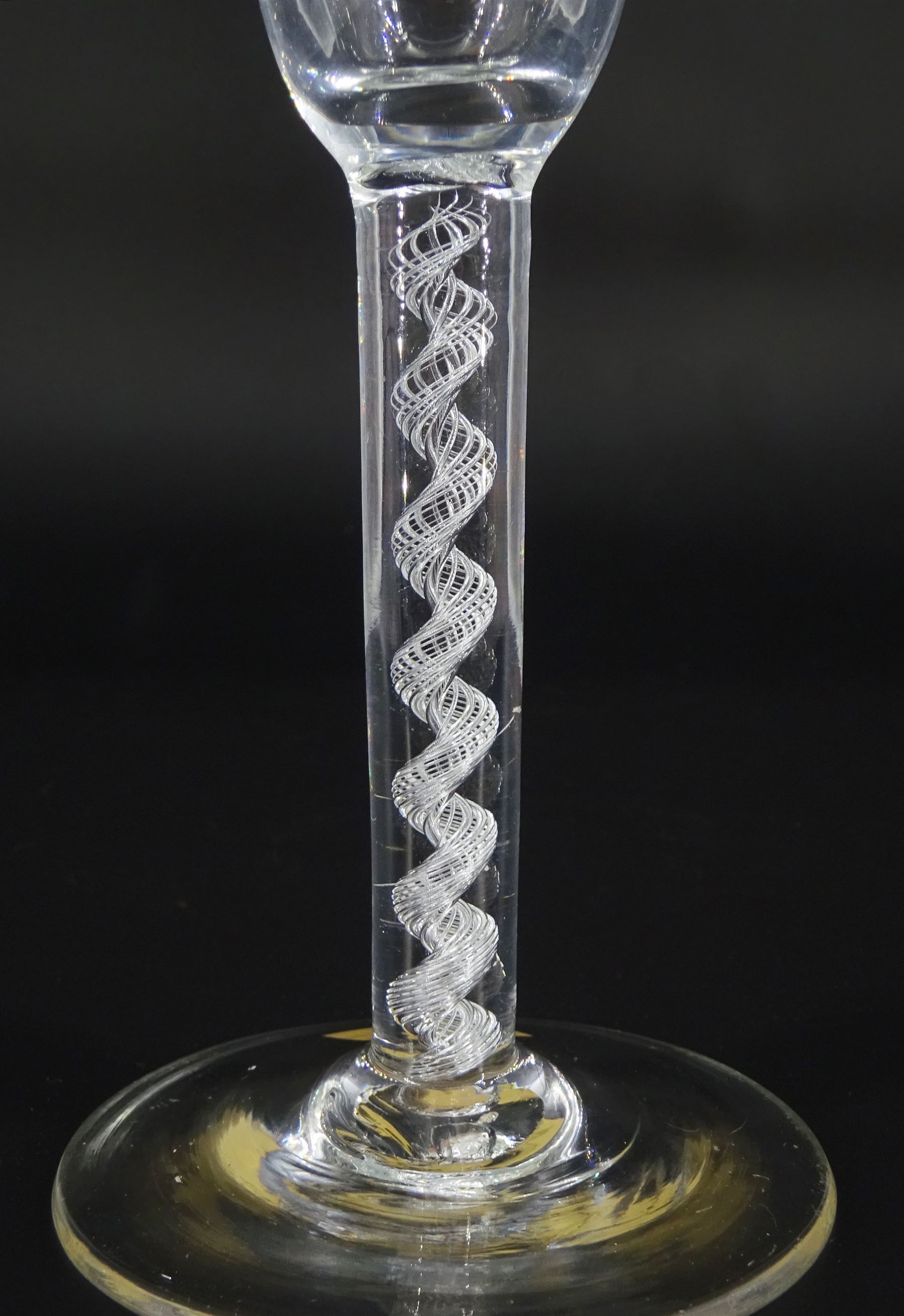 18th century drinking glass, the pan-top bowl upon a single series air twist stem and conical foot, H15cm 