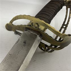 Late 18th century French 1st Empire Troupe a Pied Petit Montmorency Branch Tournante officer's sword, with 72.5cm slightly curving fullered blade, pierced brass hilt with lockable swivelling bar, fully wire-bound grip with lion head pommel, L88cm overall (no scabbard)