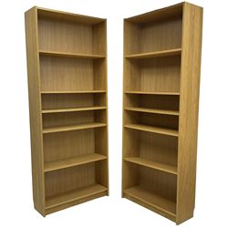 Two oak finish 6' open bookcases