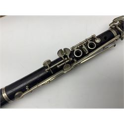 Early 20th century Hawkes and Son simple system hardwood clarinet serial no.1HM257102; cased; and a Swiss Maelzel BS Dulcet metronome of typical pyramid form (2)