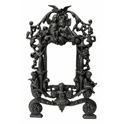 Ornate cast iron photo frame, decorated with floral swags and cherubs, with registered number stamped on back, H36cm