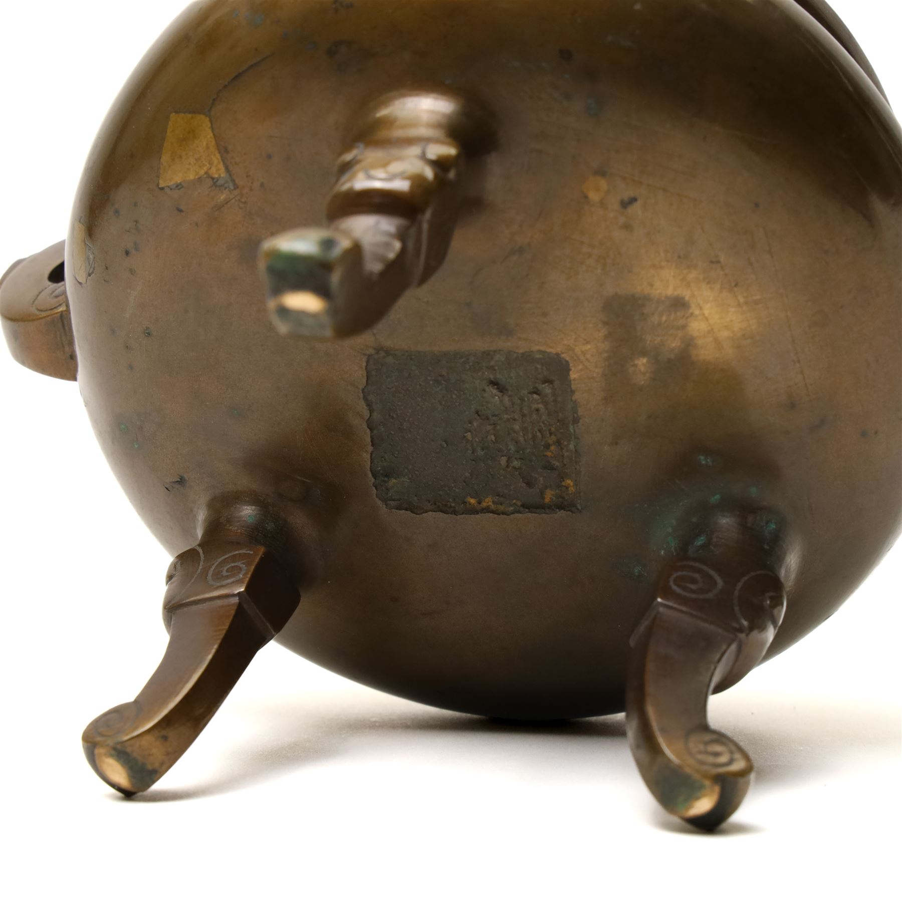 19th century Chinese bronze censer with loop handles and on shaped supports D13cm and an Asian bronze bell H17cm