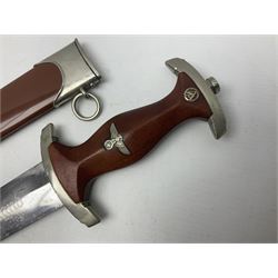 WW2 German SA dagger the 22cm double edged steel blade by G. Felix Gloriawerk Solingen inscribed 'Alles Fur Deutschland', the cross-piece impressed with the SA Gruppen mark Nm verso for Nordmark, wooden grip inset with eagle and SA emblem; in brown painted scabbard with nickel mounts L37cm overall
