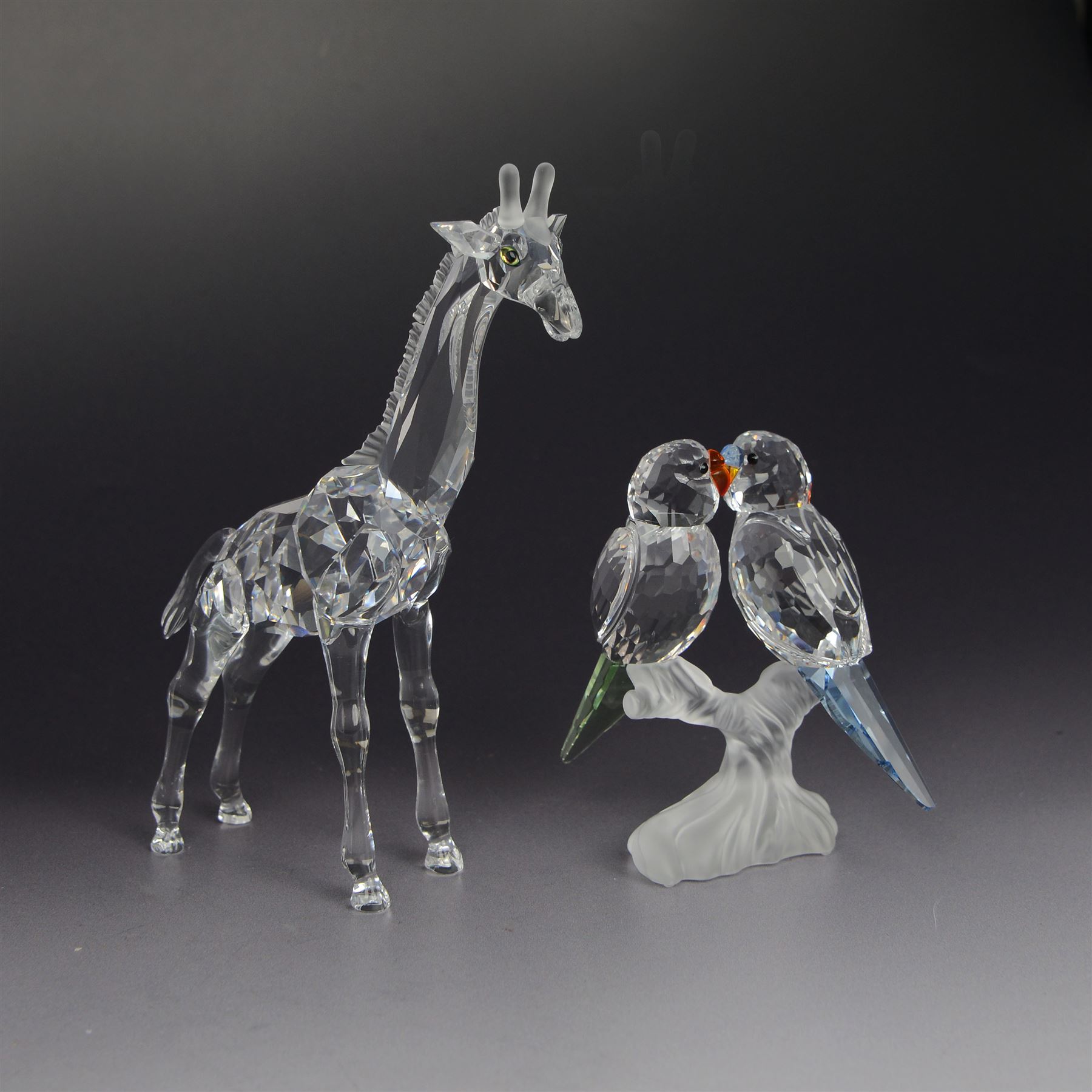 Three Swarovski figures, comprising Giraffe, Cobra and Budgies, all with original boxes  