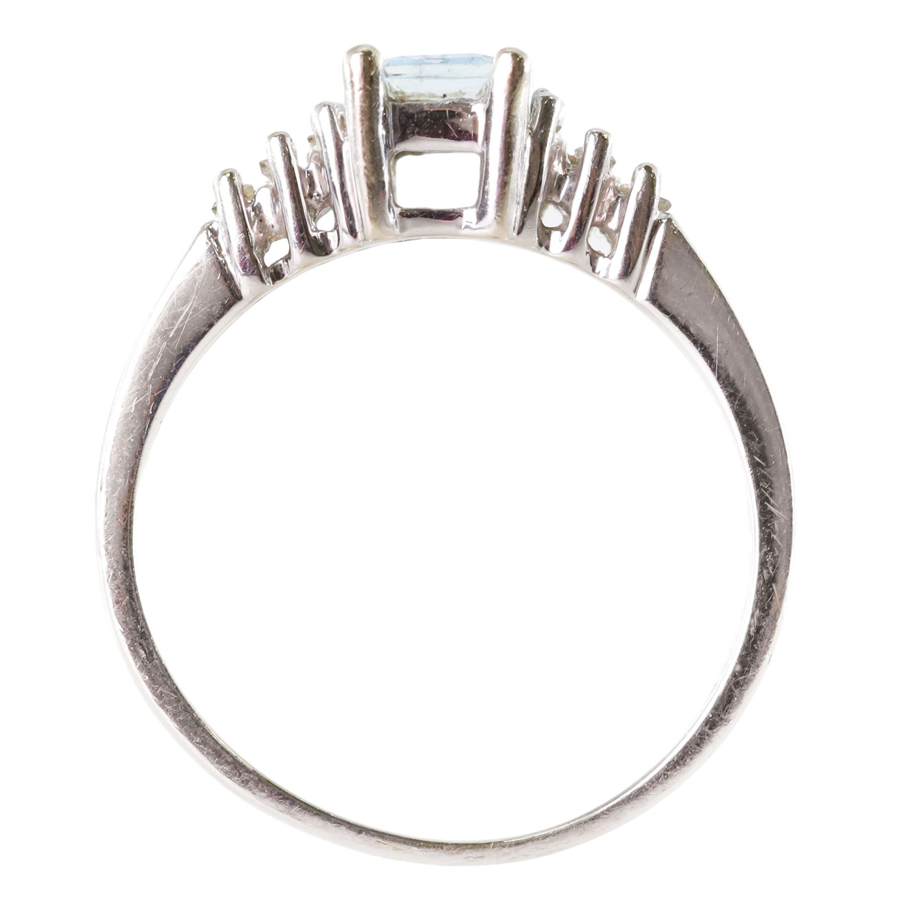 10ct white gold aquamarine and diamond ring, single octagonal cut aquamarine of approx 0.45 carat, with three tapered baguette cut diamonds set either side, stamped
