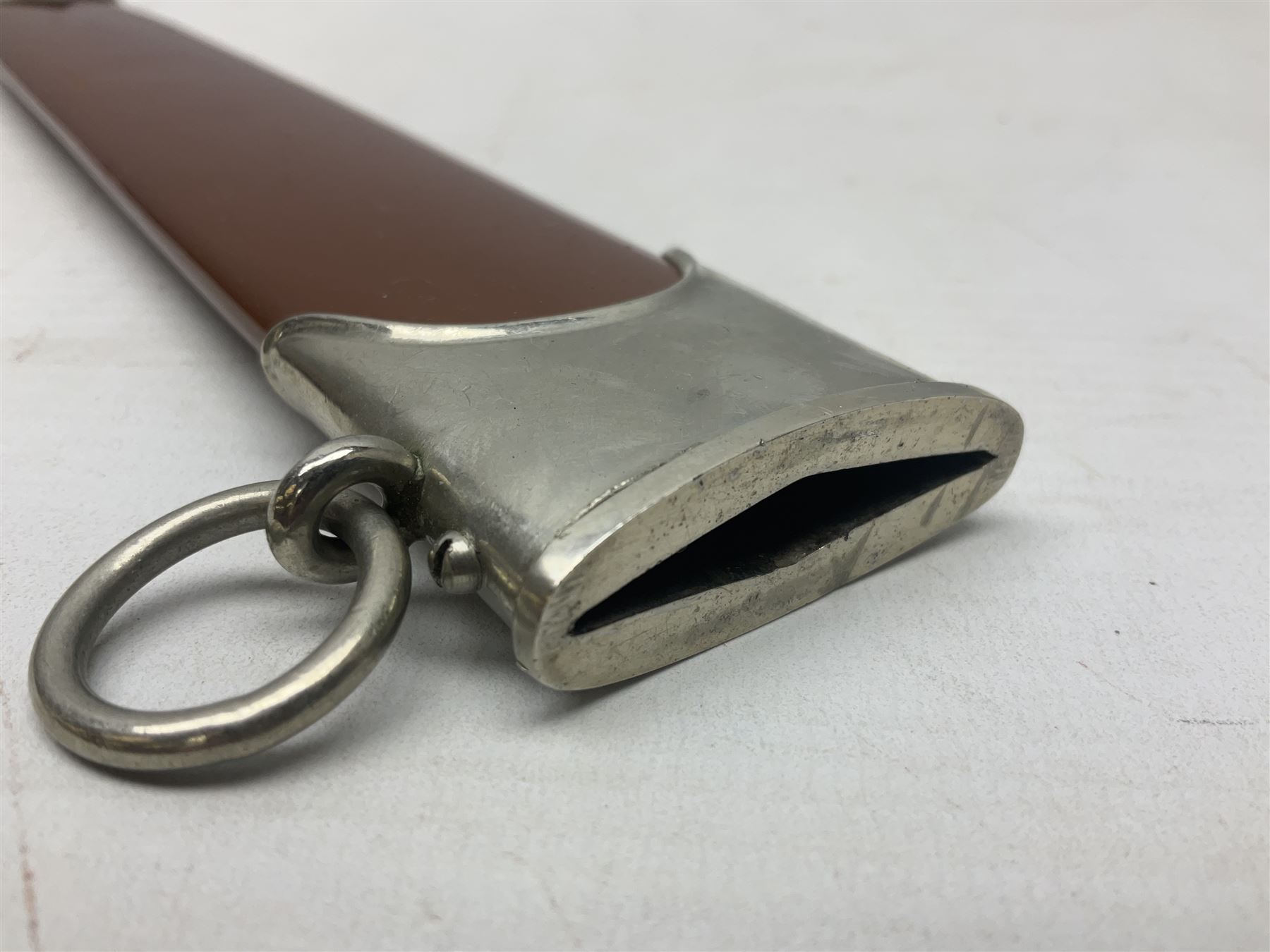 WW2 German SA dagger the 22cm double edged steel blade by G. Felix Gloriawerk Solingen inscribed 'Alles Fur Deutschland', the cross-piece impressed with the SA Gruppen mark Nm verso for Nordmark, wooden grip inset with eagle and SA emblem; in brown painted scabbard with nickel mounts L37cm overall