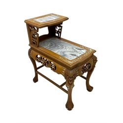 Pair of Chinese hardwood side or end tables, two moulded tiers with grey marble insets, inlaid with trailing foliate motifs in mother of pearl, with scrolling fretwork frieze rails, on cabriole supports with ball and claw feet united by plain stretchers 