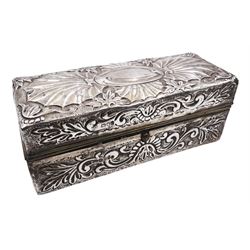 Late Victorian silver jewellery box, of rectangular form, embossed throughout with foliate scrolls, the hinged cover with vacant oval panel, hallmarked Charles Fox & Co Ltd, London 1896, H6cm W15.5cm D5.5cm, (with weighted base)