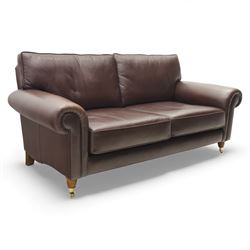Laura Ashley - brown leather two seater sofa, loose cushion back and seat, flanked by scro...