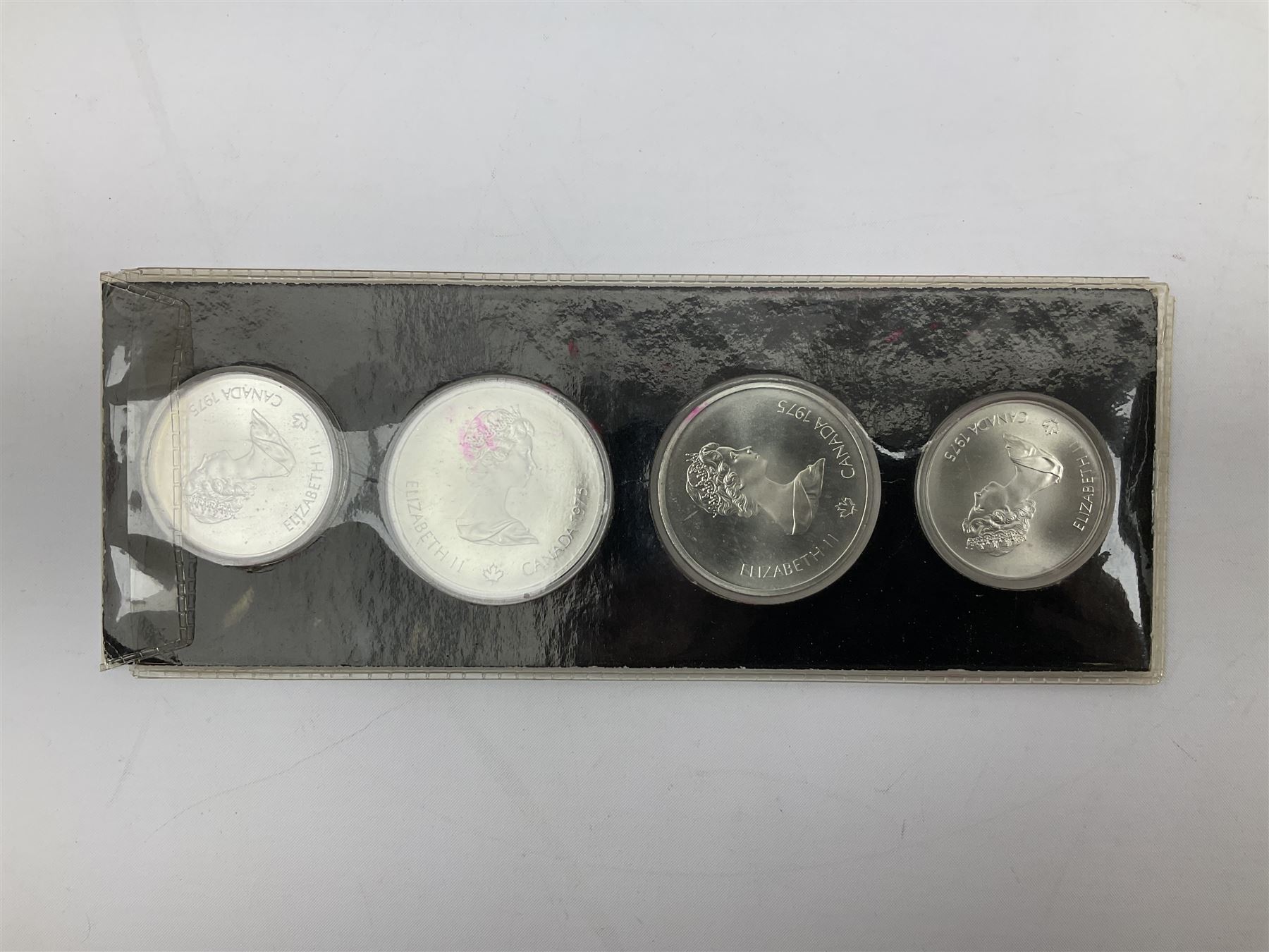Canadian coinage including Queen Elizabeth II 1964 and four 1966 dollars, 1975 Olympic four coin set comprising two five dollar and two ten dollar coins, 1995 specimen coin set in blue folder, 1995 uncirculated coin set etc 