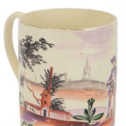 18th century Leeds creamware mug, circa 1770, of cylindrical form with curved strap handle, painted in purple, red and green with a peasant toasting with a glass of ale within a bucolic setting, H12.5cm