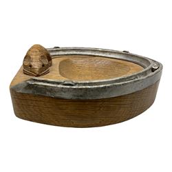Mouseman - oak horseshoe ashtray, rounded triangular form with mounted horseshoe, carved with mouse signature, by the workshop of Robert Thompson, Kilburn, L13cm