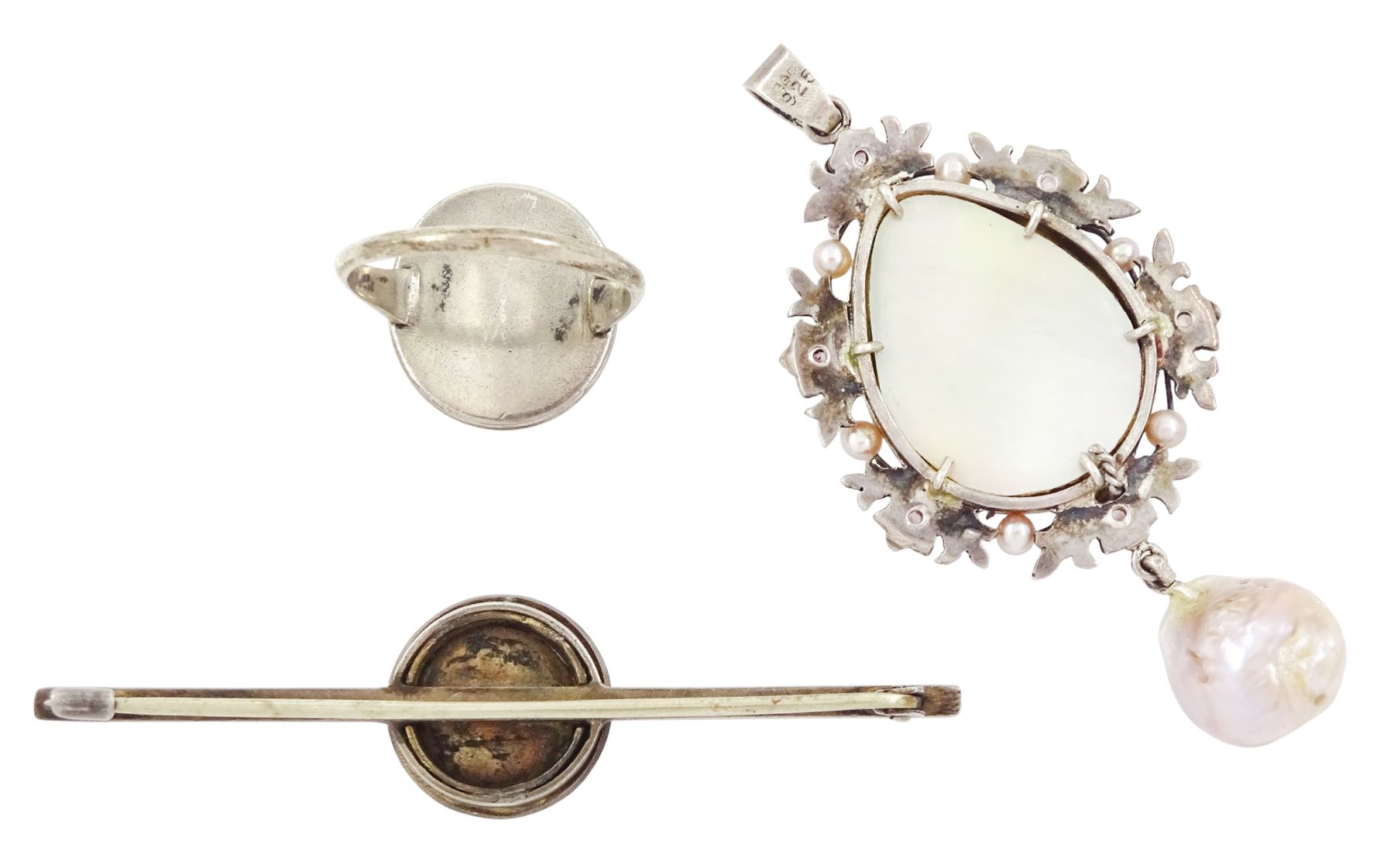 19th/ early 20th century silver portrait miniature jewellery including a pearl set pendant painted with a cherub, a ring painted with a young girl wearing a bonnet and brooch with seed pearl surround, all on ivory. This lot has been registered for sale under Section 10 of the APHA Ivory Act