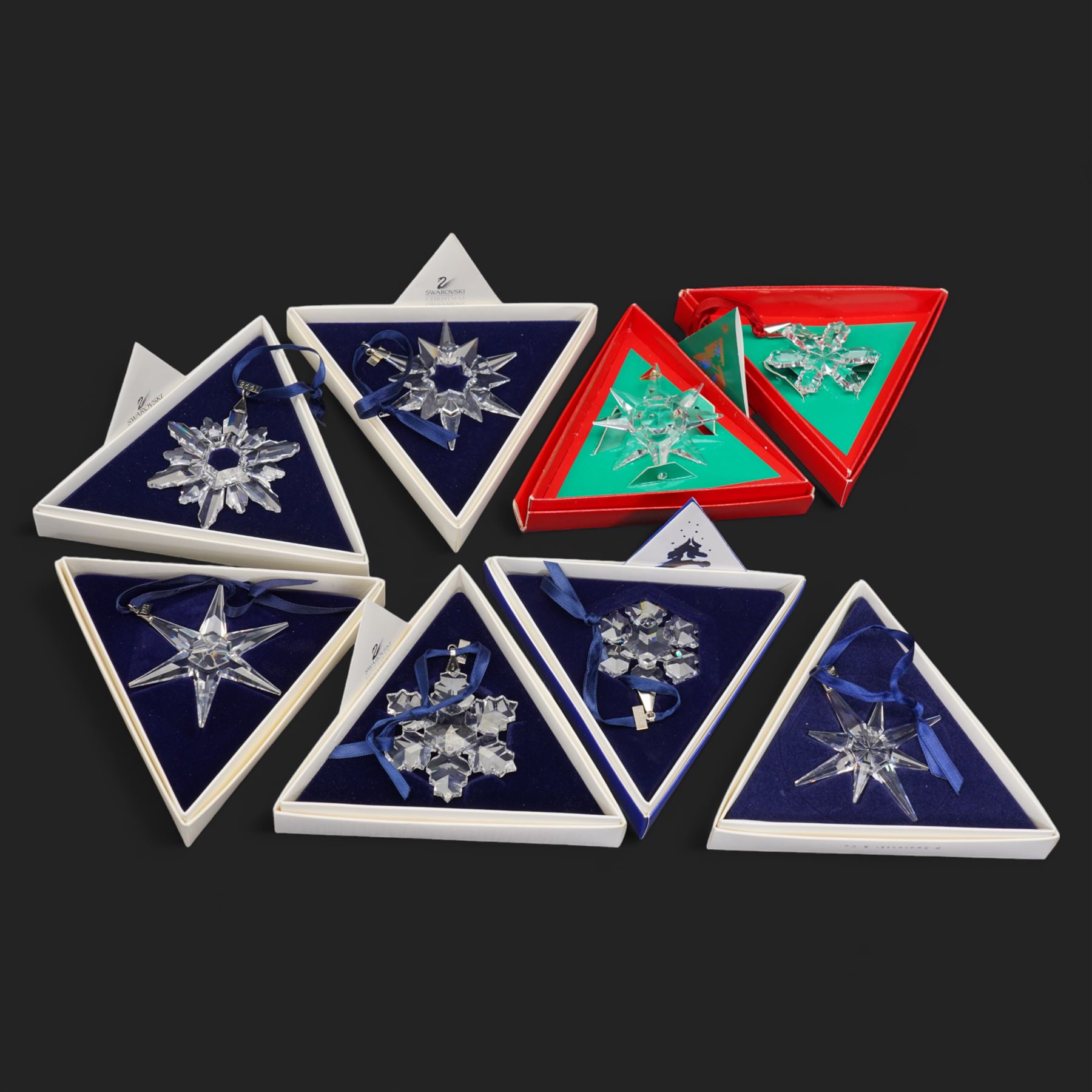Eight Swarovski crystal snowflake Christmas ornaments, comprising years 1991-1998, some with certificates, boxed (8)