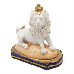 Early 19th century English porcelain miniature rosewater sprinkler in the form of a coffee pot, floral encrusted and painted body with flower knop handle and scroll handle, pattern no. 7916, H16.5cm, 19th century Rockingham style seated model of a Lion, L9.5cm and an early 19th century oval dish, inscribed beneath Geo. Maddey, 1803 (3)