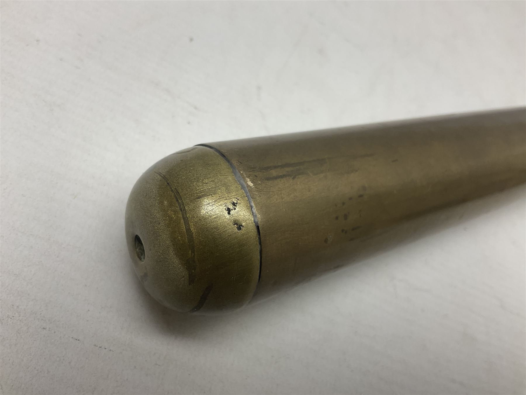 French Naval divers brass handled knife, the 20.5cm single edged steel blade held in place with wooden wedges, tapering ribbed grip with domed pommel and original screw-on scabbard with drain hole L38cm overall