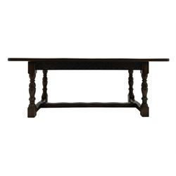 Large oak refectory dining table, rectangular top over guilloche carved frieze rails, turned supports joined stretchers