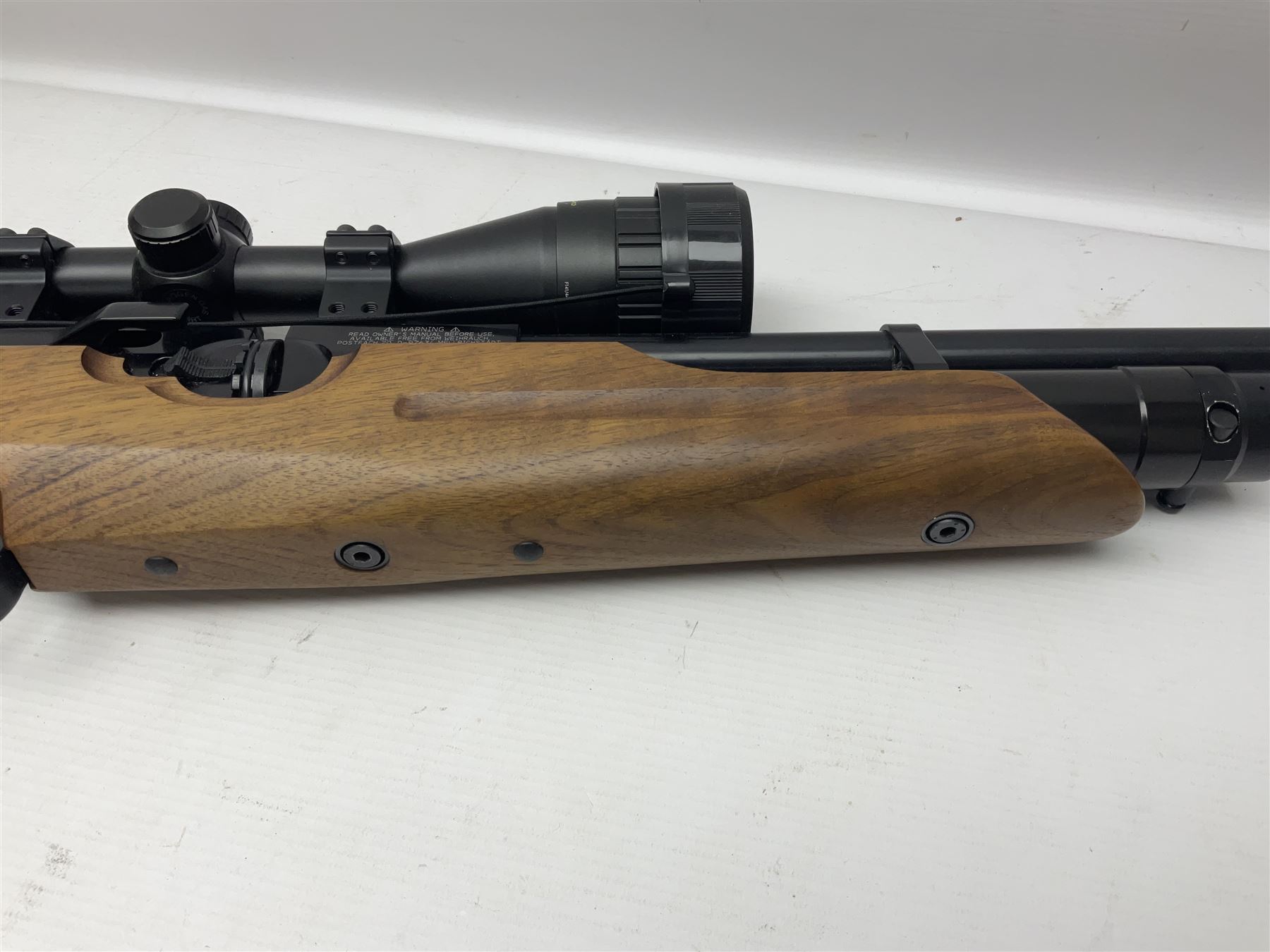 Weihrauch Sport HW100 .177 calibre PCP repeating air rifle; walnut thumbhole stock with textured pistol-grip; fourteen-shot magazine; Nikko Stirling Gameking 3.5 -10x44 illuminated telescopic sight; No.1922087 L90cm overall; in Napier fleece lined gun sling; with re-filling air tank and quantity of pellets NB: AGE RESTRICTIONS APPLY TO THE PURCHASE OF AIR WEAPONS.