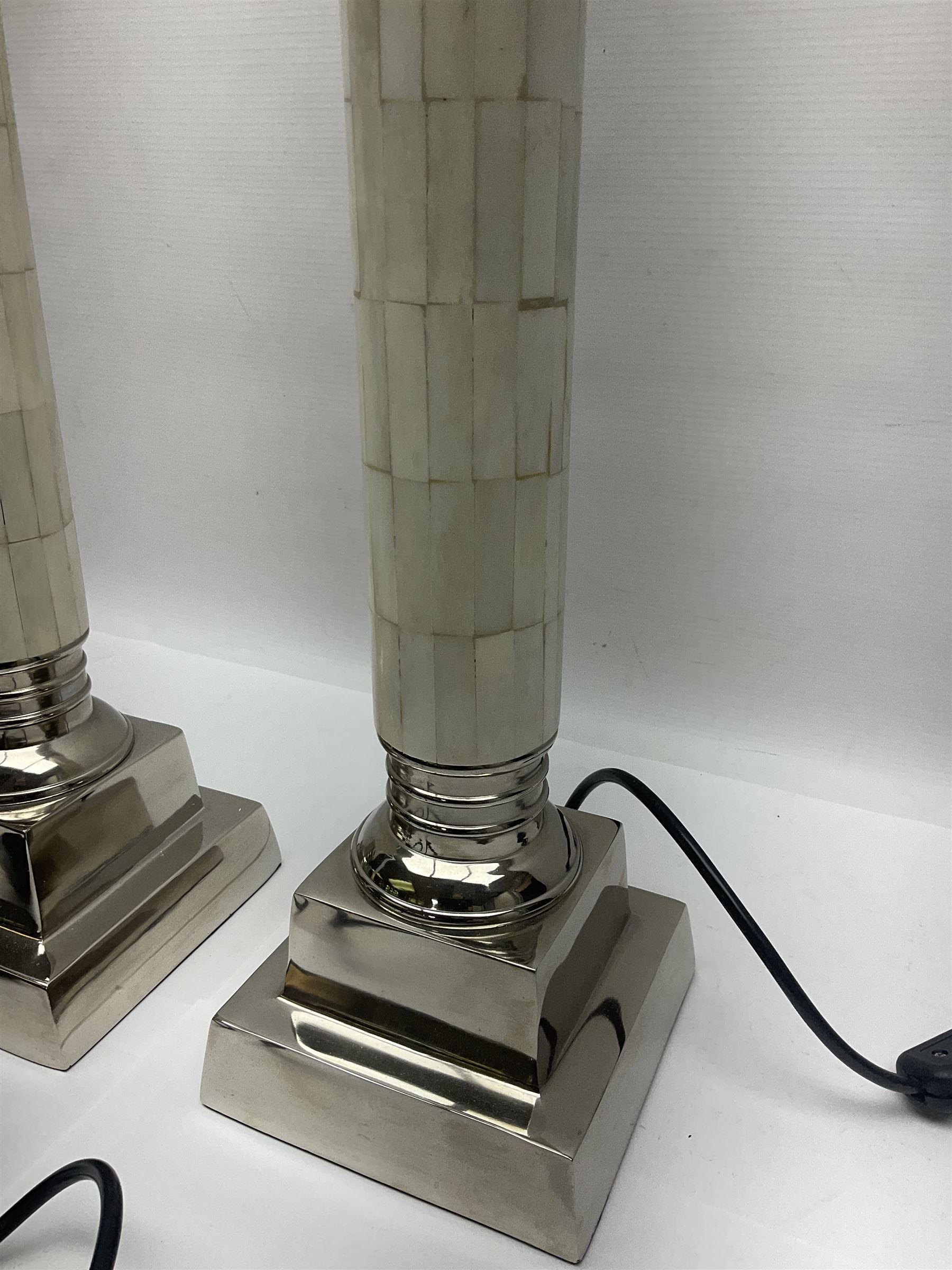Pair of Parex table lamps, each of columnar form, the column with mosaic design standing on a stepped plinth, H68cm
