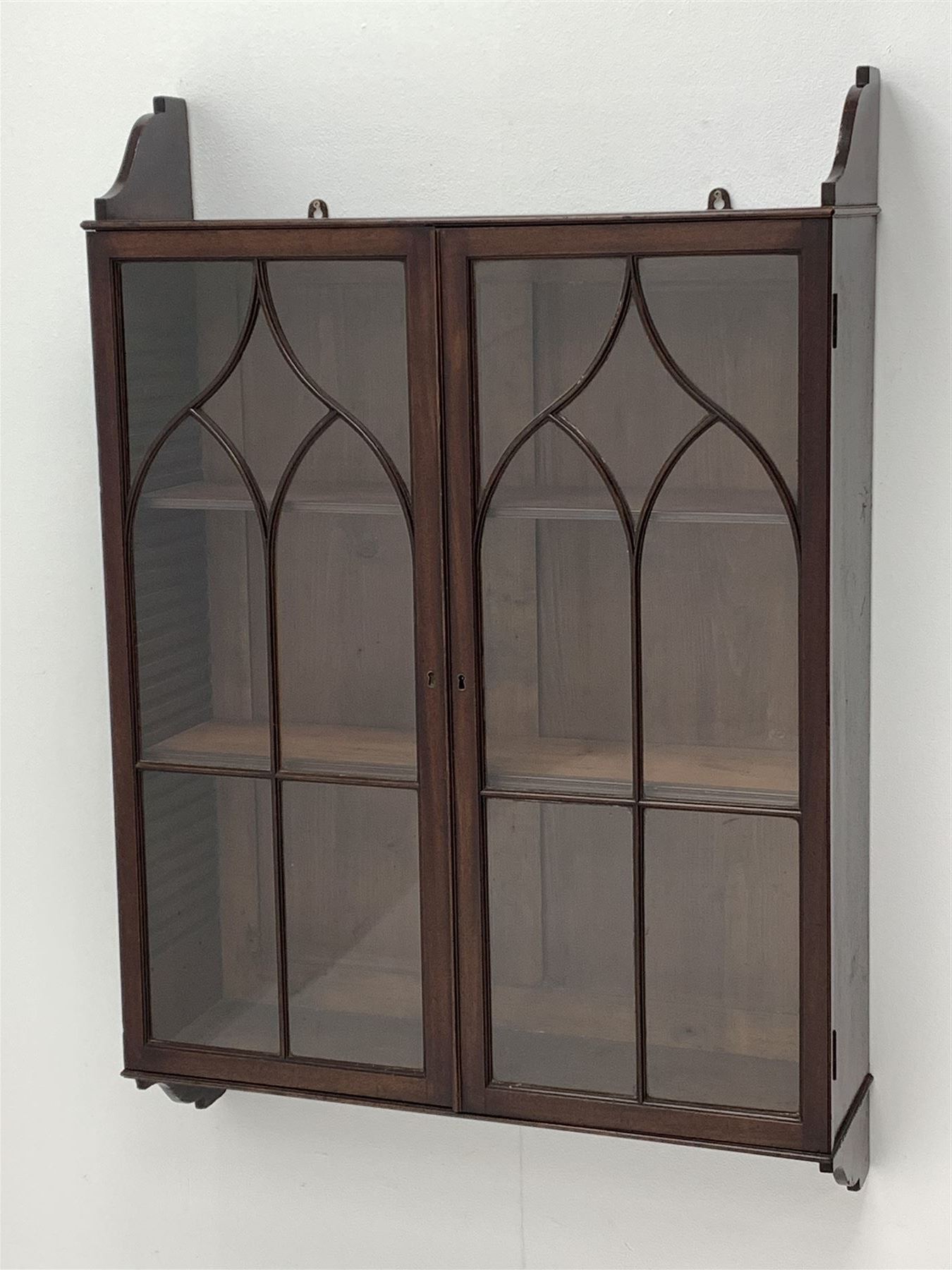 Georgian mahogany Gothic wall hanging cabinet, enclosed by two ogee pointed arch astragal glazed doors, plain sides with shaped top and bottom brackets