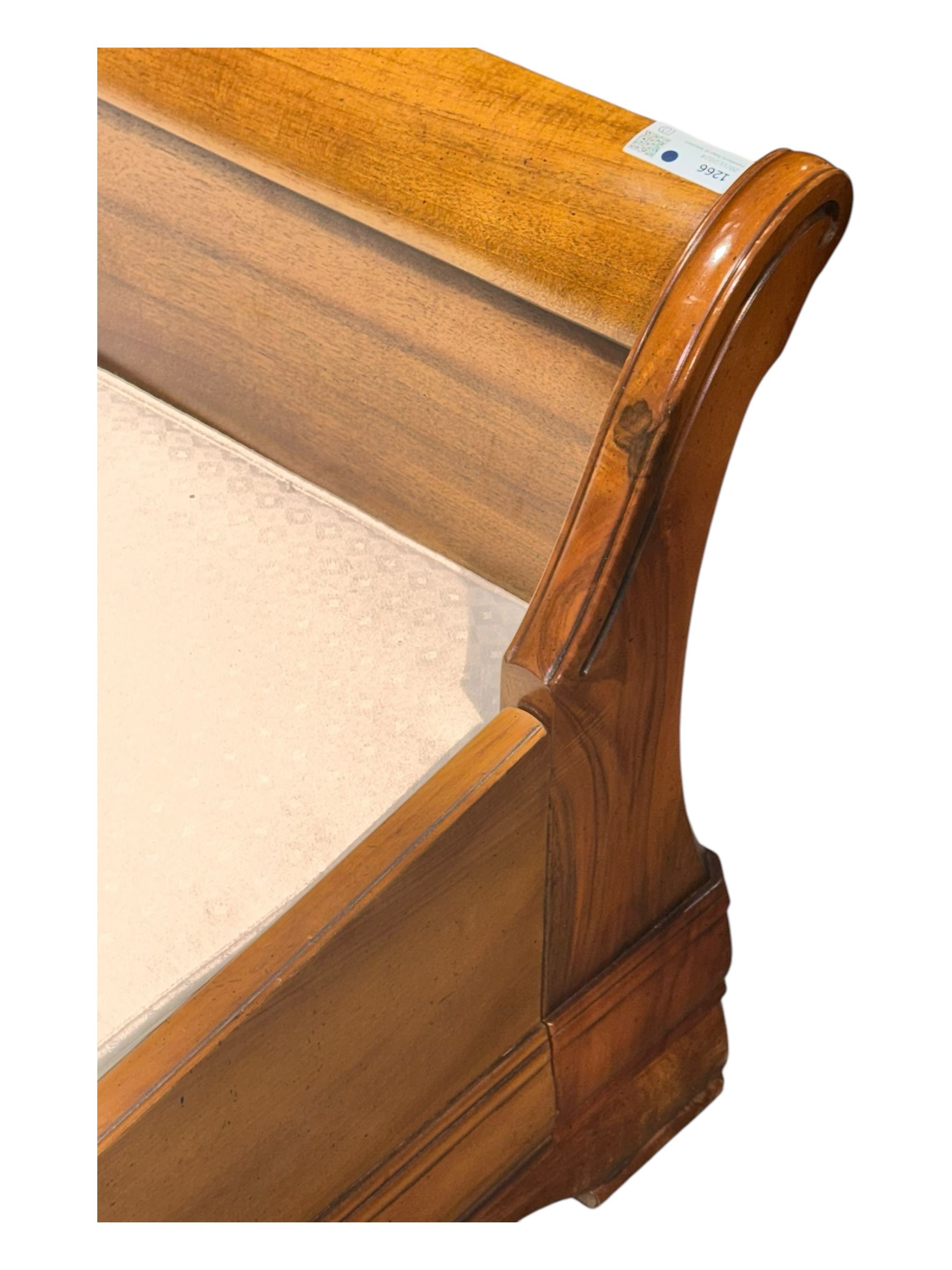 French cherry wood 6' Super King sleigh bed, curved headboard and footboard with panelled detailing, complete with supportive hardwood box base upholstered in a light-textured fabric, raised on bracket feet