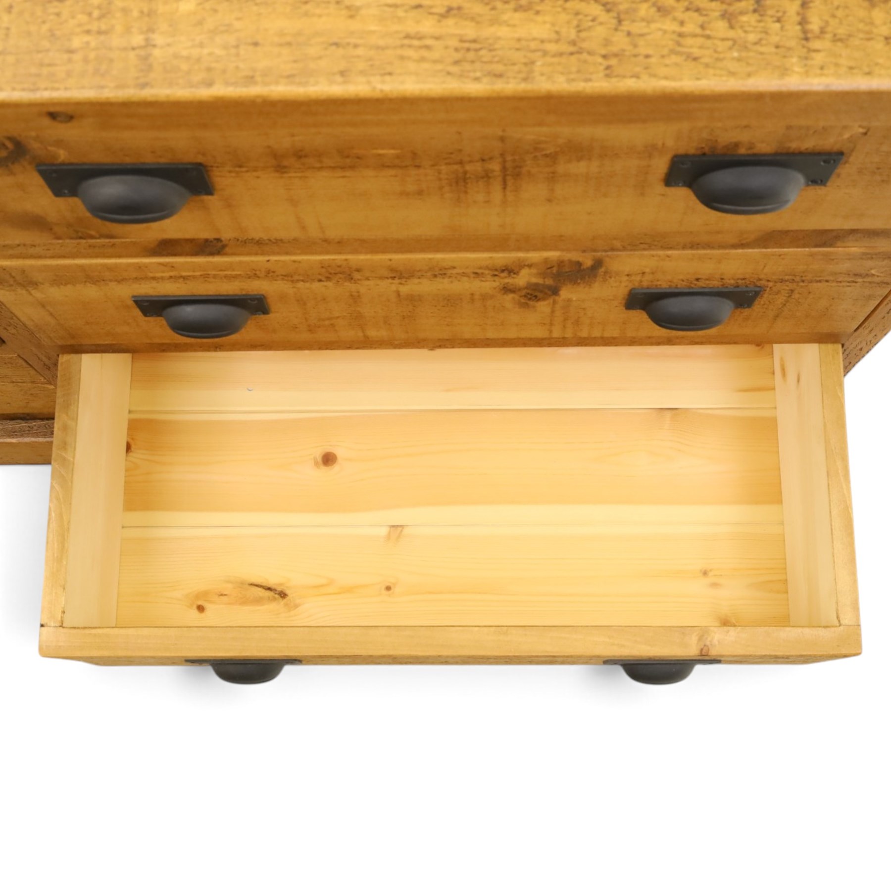 Indigo Furniture - large rustic oak chest, rectangular top fitted with six drawers with metal pull handles, on skirted base