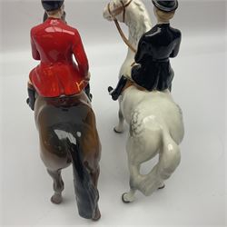 Beswick hunting group, comprising huntswoman on dappled grey horse no 1730, huntsman on bay horse no 1501, two fox figures no 1440 and 1748, and four fox hounds, all with printed marks beneath (8)