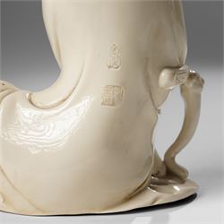 Three Chinese blanc de chine figures, each depicting Guanyin seated, Dehua province, two with double gourd and potters seal marks to the reverse 