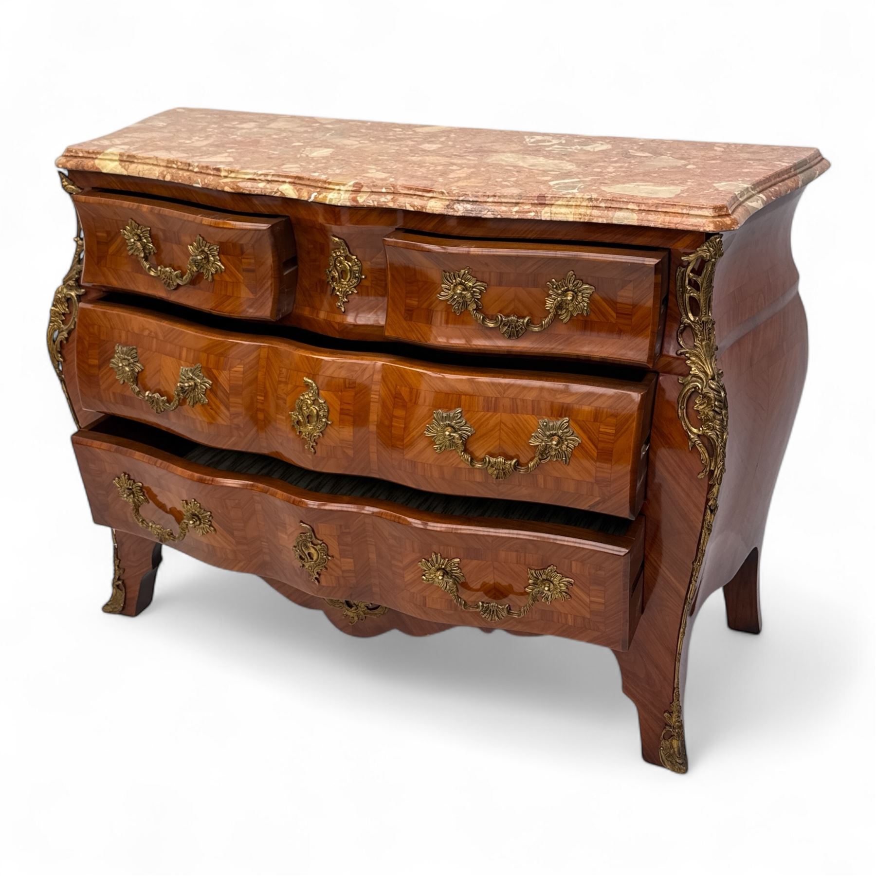 20th century Louis XV design serpentine commode, the rectangular breccia marble top with a rounded moulded edge and projecting corners, above a bombe bombe-shaped kingwood and parquetry design front of two short and two graduated drawers with rococo style handles, corners with gilt-bronze foliate mounts on short cabriole form feet with gilt bronze sabots  